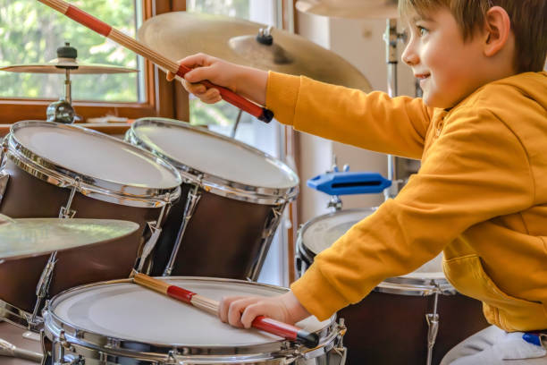 istock A happy little kid plays drums 2157634425