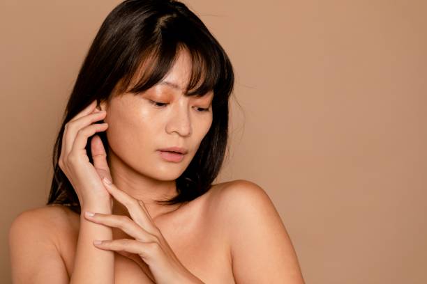 istock Beautiful Chinese woman, beige background 2157634456
