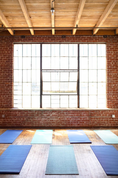 istock Yoga mats on a wooden floor 2157637359