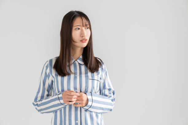 istock asian woman in night clothes,Smile 2157637483