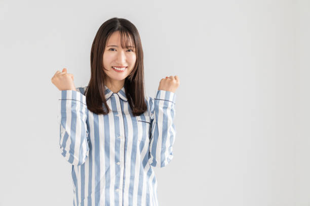 istock asian woman in night clothes,Smile 2157637493