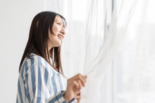 istock asian woman in night clothes,Smile 2157637577