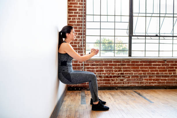 istock Woman exercising at the gym 2157637671