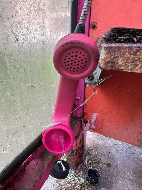 Old broken phone in the phone booth