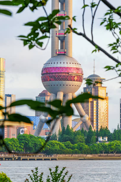 istock Huangpu River and Oriental Pearl TV Tower in the setting sun 2157641902