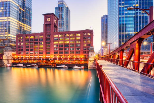Harrison Street Bridgehouse and Bridge across the South Branch of the Chicago River in the South Loop, downtown Chicago. Old post office building in the background.