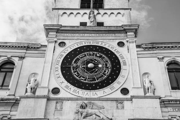 Vicenza, VI, Italy - May 10, 2024: Clock Tower called Torre Bissara most famous landmark of the city with big italian flag