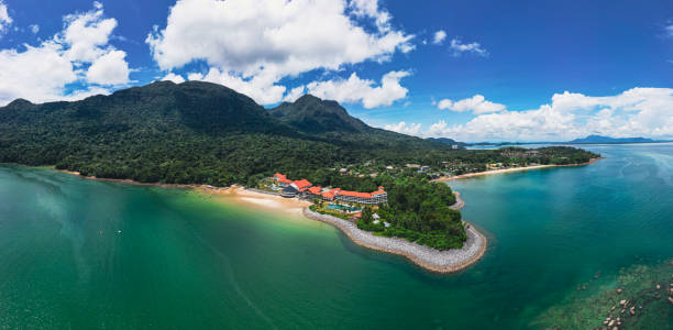 Luxury resort by the sea with mountainous view in the background. Curated lifestyle concept. Luxurious living. Tourism in nature.
