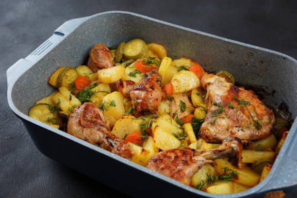 The curry chicken chunks on the plate on the table are made from potatoes, chicken breast, and curry.