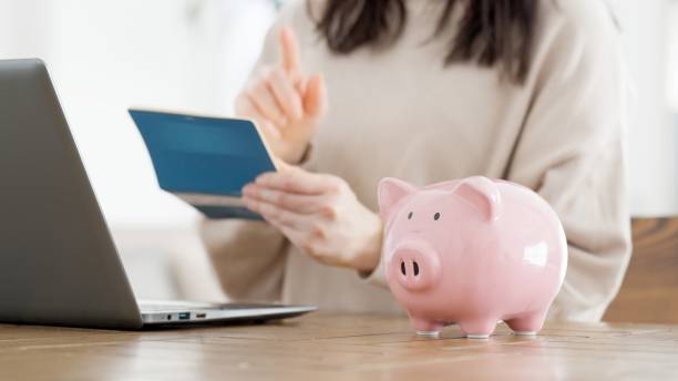 istock A woman checking her bankbook balance 2157646470