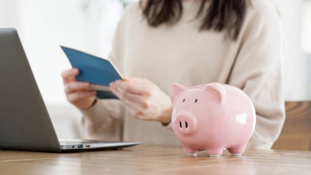 istock A woman checking her bankbook balance 2157646473