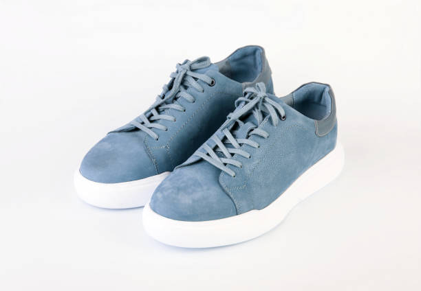 istock Pair of comfortable suede shoes on white background 2157649726