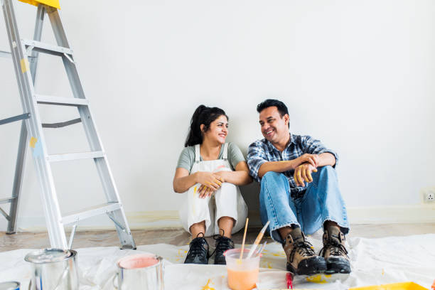 istock Couple taking a break from painting the walls 2157651558