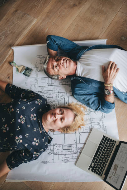 istock Couple lying on the floor in their new house 2157651697