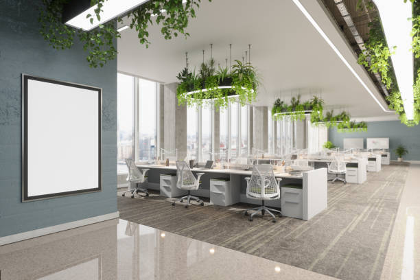 Eco-Friendly Open Plan Office Interior With Creeper Plants And Close-up View Of Empty Poster On The Wall