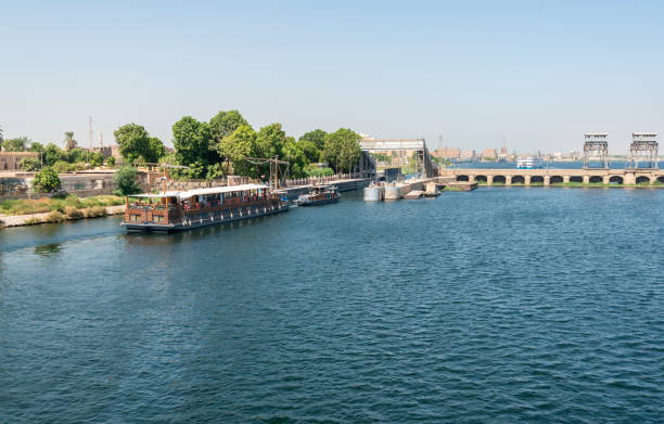istock Cruise ships enters the sluice gate on the Nile river barrage bridge 2157653274