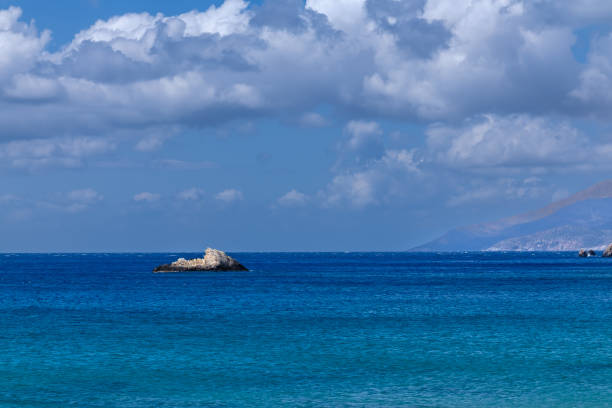 View of the beautiful Aegean Sea and a cliff from a beach in Ios Greece
