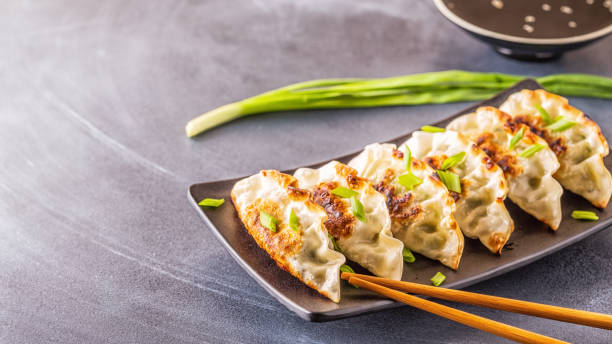 istock gyoza or dumplings snack with soy sauce 2157654053