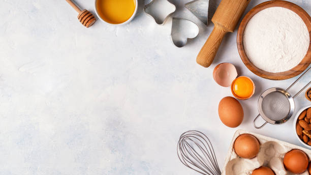 istock Ingredients for baking  - flour, wooden spoon, eggs. 2157654136