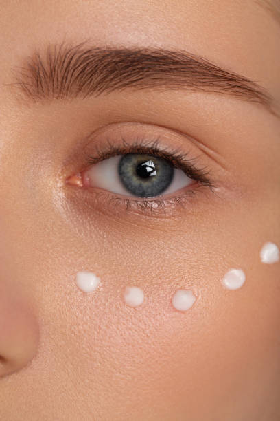 istock Beautiful girl using cream on her face 2157654586