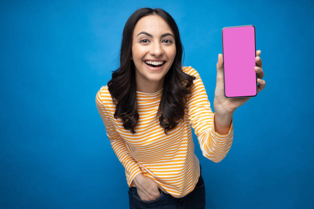 istock Young woman showing device screen isolate white background stock photo 2157655843