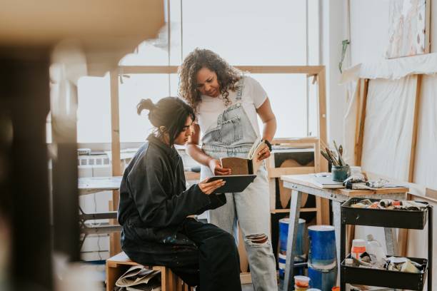 istock Woman artists collaborating together in their art studio 2157657513