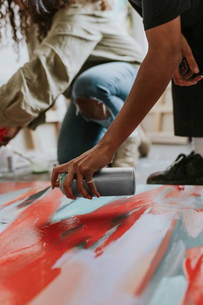 istock Woman artists collaborating on a painting 2157657706