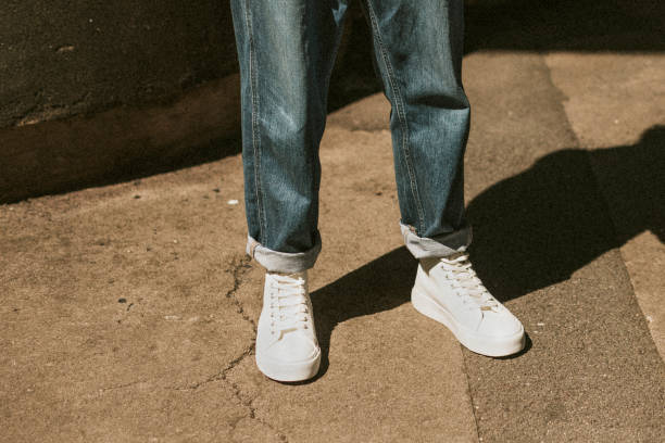 istock Man in blue jeans white high top sneakers mockup dark tone 2157659359
