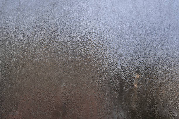 istock wet window glass. textured background of a drop on glass. 2157660267