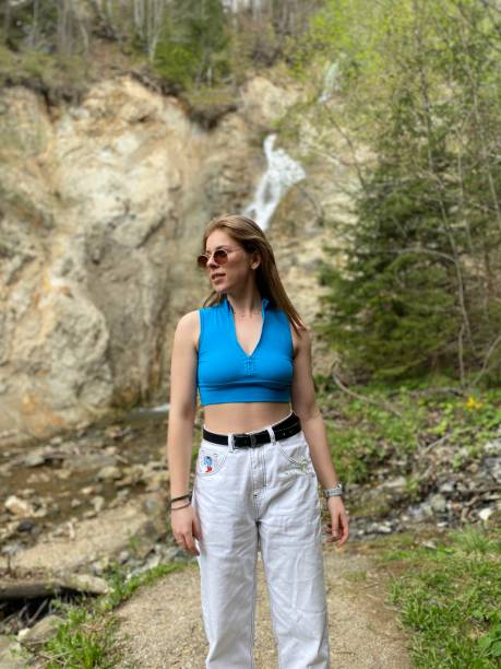 istock Girl relaxing near the waterfall 2157660337
