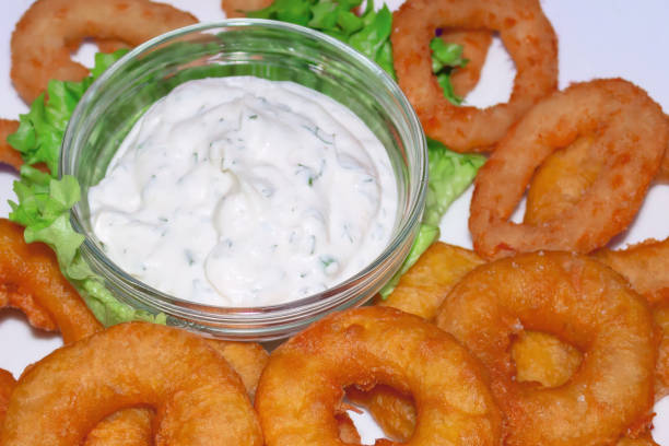 Delicious onion rings with savory dipping sauce