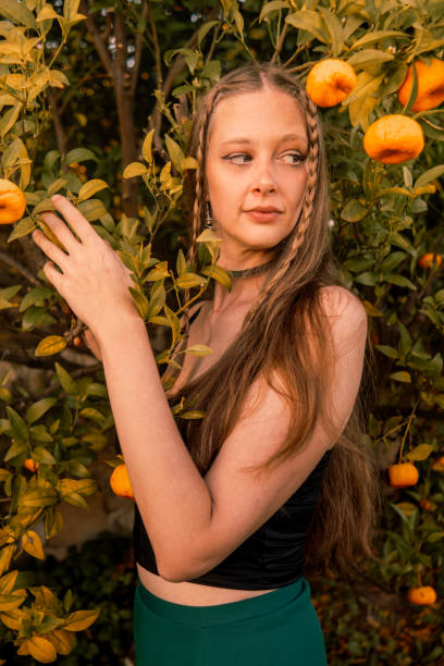 istock Woman and the orange tree 2157661289