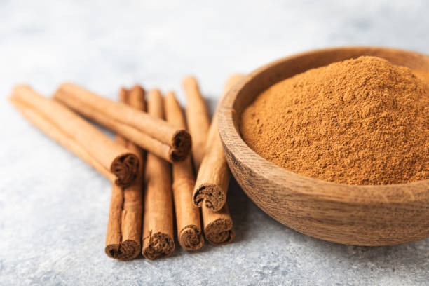 istock Ceylon cinnamon.Cinnamon sticks on a textured wooden background. Cinnamon roll and powder. Spicy spice for baking, desserts and drinks. Fragrant ground cinnamon. Close-up. Place for text. copy space 2157663036