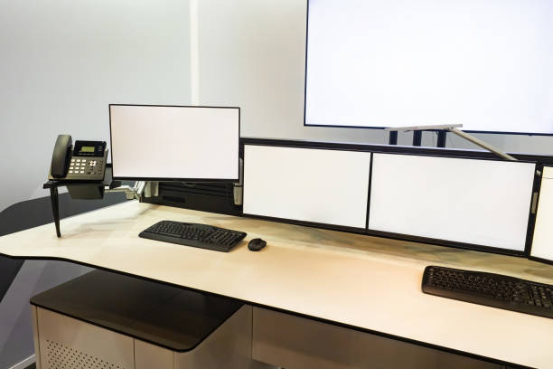 istock Mockup of monitors in control room. Many monitors with blank display. Security point for CCTV cameras. Concept is enterprise management center. Dispatchers work table. Factory control room 2157666757