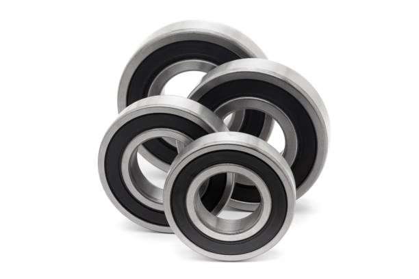 istock Four tapered roller bearings of different sizes, isolated on a white background. 2157667816