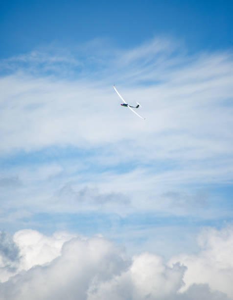 istock a sailplane in the air above the clouds 2157667901