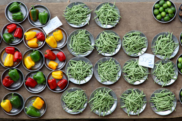 Point of View: Retail market displaying vegetables