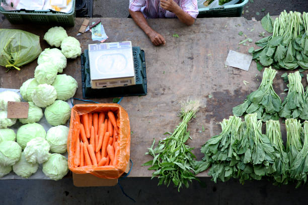 Point of View: Retail market displaying vegetables