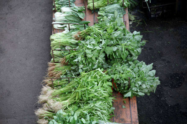 Asian morning market selling local produces - varieties of vegetables