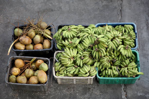 Asian morning market selling local produces-fresh banana and coconut