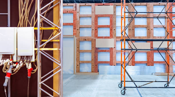 istock Temporary walls with electrical equipment. Preparing for exhibition concert. Temporary structures indoors. High voltage wires are fixed on wall. Concept service for installation exhibition equipment 2157671430