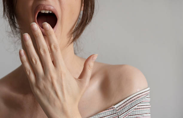 istock Yawning and covering mouth 2157674267