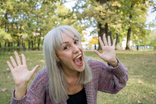 Successful girl gives thumb up with two hands