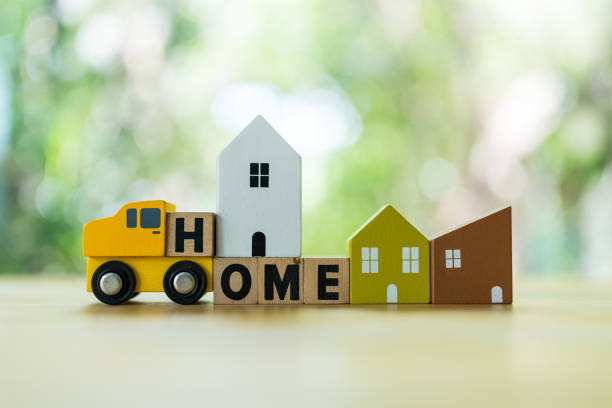 istock Wooden cubes with text HOME with home and car. 2157675455