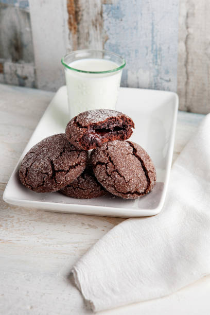 istock Cookie filled with chocolate cream. Chocolate cookies and milk. Biscuits filled with chocolate cream. Chocolate cream cookies. Dark Chocolate Cookies and milk. Cookies souffle. 2157682377