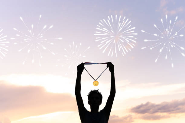 istock Athlete Celebrating Victory with His Gold Medal 2157682904
