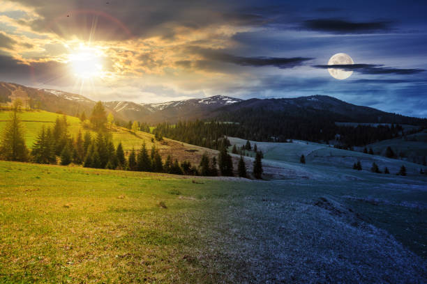 istock mountain landscape with sun and moon at spring equinox 2157688178