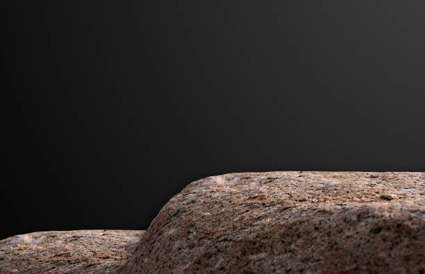 istock Brown Rock Stone Podium on Dark Grey Wall backgrounds,Empty Studio with Natural Sea Stone texture stage stand display for product Present.Backdrop Rock pedestal for cosmetic and fashion branding ideas 2157689066