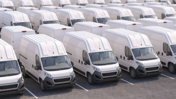 istock Express delivery service concept. Delivery vans and trucks in a row on parking. 2157689096
