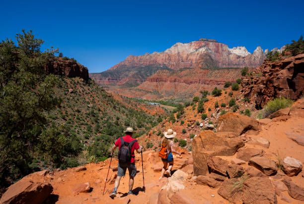 istock Couple hiking in red mountains in Utah. 2157691009